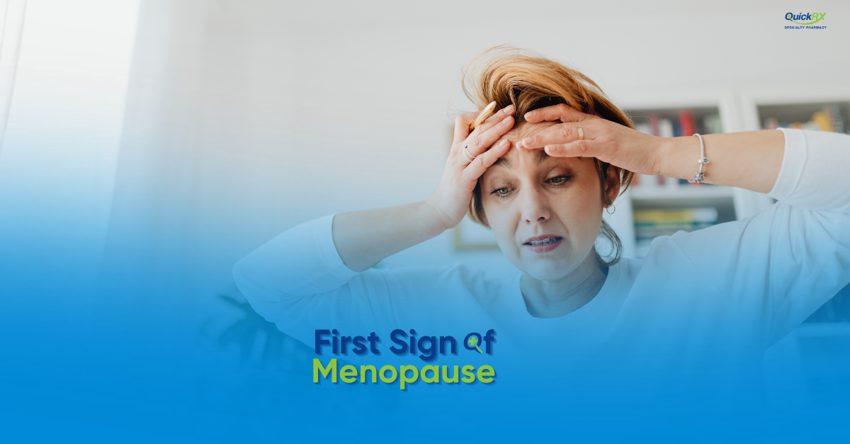 Woman holding her forehead and looking uncomfortable, for a QuickRX Specialty Pharmacy guide to the first signs of menopause