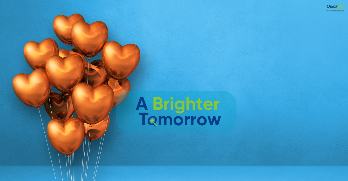 Gold heart-shaped balloons floating against a blue background with the words “A Brighter Tomorrow.”