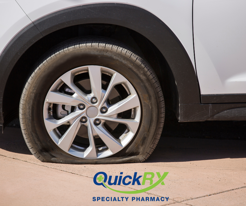 Flat car tire on road representing erectile dysfunction as a fixable problem