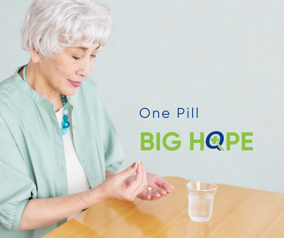 Alt Text: "Hopeful woman holding a small white pill in her palm, preparing to take her Tasigna medication for chronic myeloid leukemia treatment