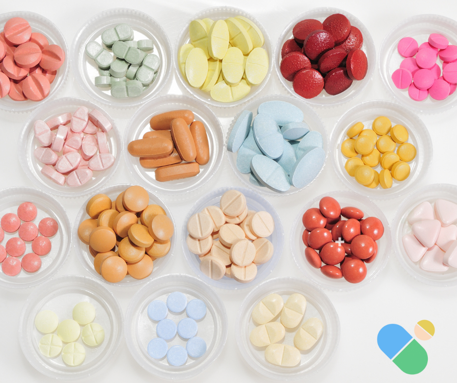 Organized collection of various colored tablets sorted in small clear containers
