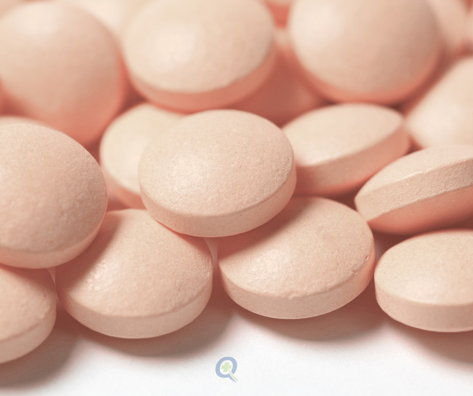 Close-up of various medication tablets highlighting the drug interactions and contraindications