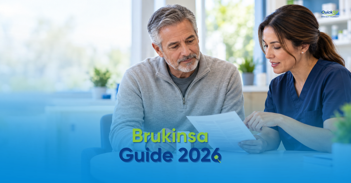 Older man in a gray sweater reviewing Brukinsa (zanubrutinib) information with a QuickRx pharmacist in navy scrubs, with the title Brukinsa Guide 2026